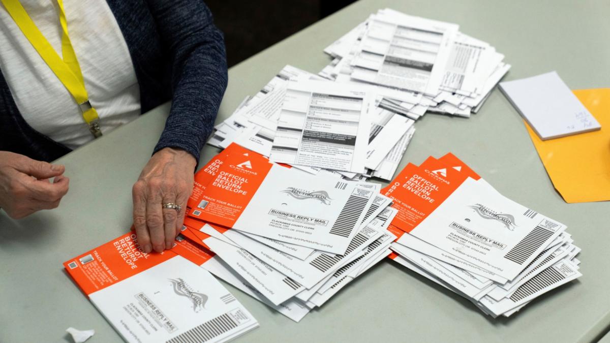 An election worker reaches for an unopened ballot during sorting at the Clackamas County Elections office, Nov. 7, 2024, in Oregon City, Ore. (AP Photo / Jenny Kane, File)