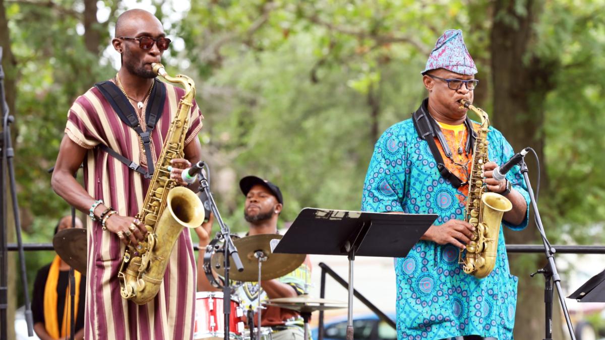 Saxophonist and Englewood Jazz Festival founder Ernest Dawkins, right, performs during the festival. Since starting the festival, Dawkins said there’s been an increase in arts and cultural programming in the neighborhood. “It's been instrumental in reawakening the artistic renaissance in the community,” Dawkins said. (Courtesy of Englewood Jazz Festival)
