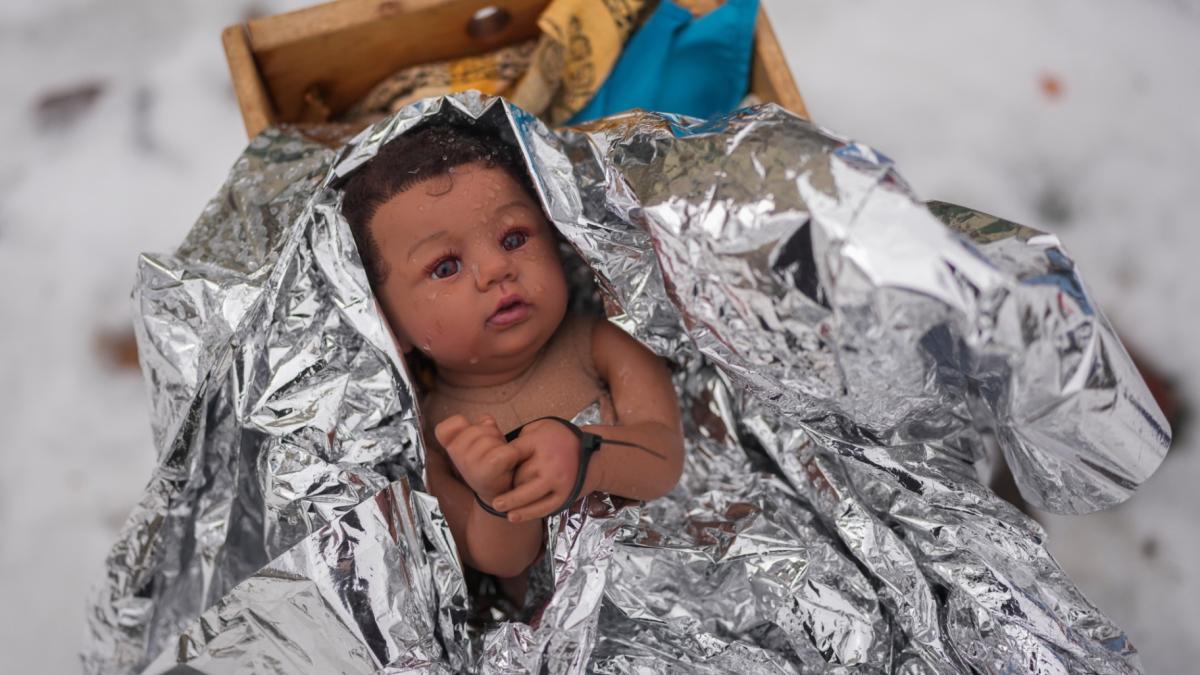 A doll representing the baby Jesus is zip-tied in the Nativity scene outside of Lake Street Church of Evanston, Wednesday, Dec. 10, 2025, in Evanston, Ill. (AP Photo / Erin Hooley)