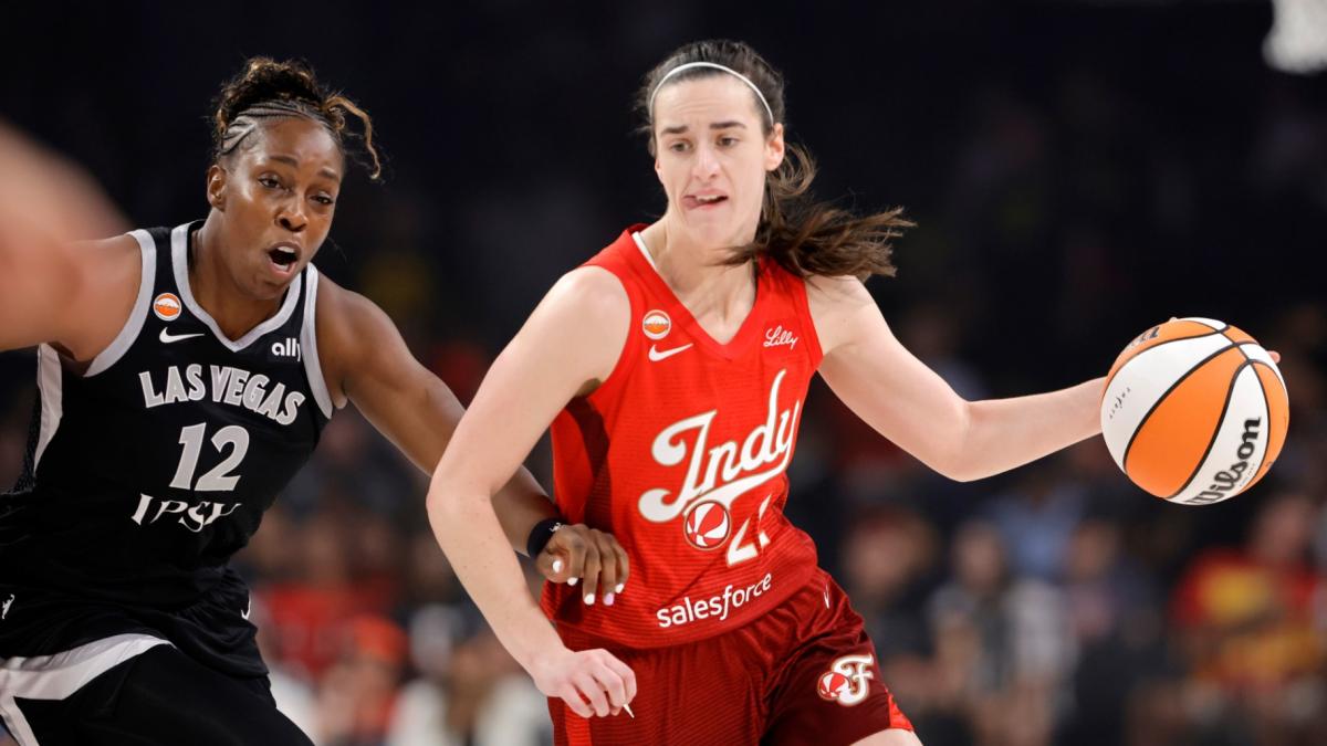 Indiana Fever guard Caitlin Clark (22) drives against Las Vegas Aces guard Chelsea Gray (12) during the first half of a WNBA basketball game Sunday, July 12, 2026, in Las Vegas. (Steve Marcus / Las Vegas Sun via AP)