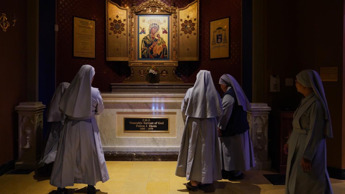 Nuns pray at the tomb of Archbishop Fulton Sheen at the Cathedral of St. Mary of the Immaculate Conception in Peoria, Ill., on July 15, 2026. (AP Photo / Jessie Wardarski)