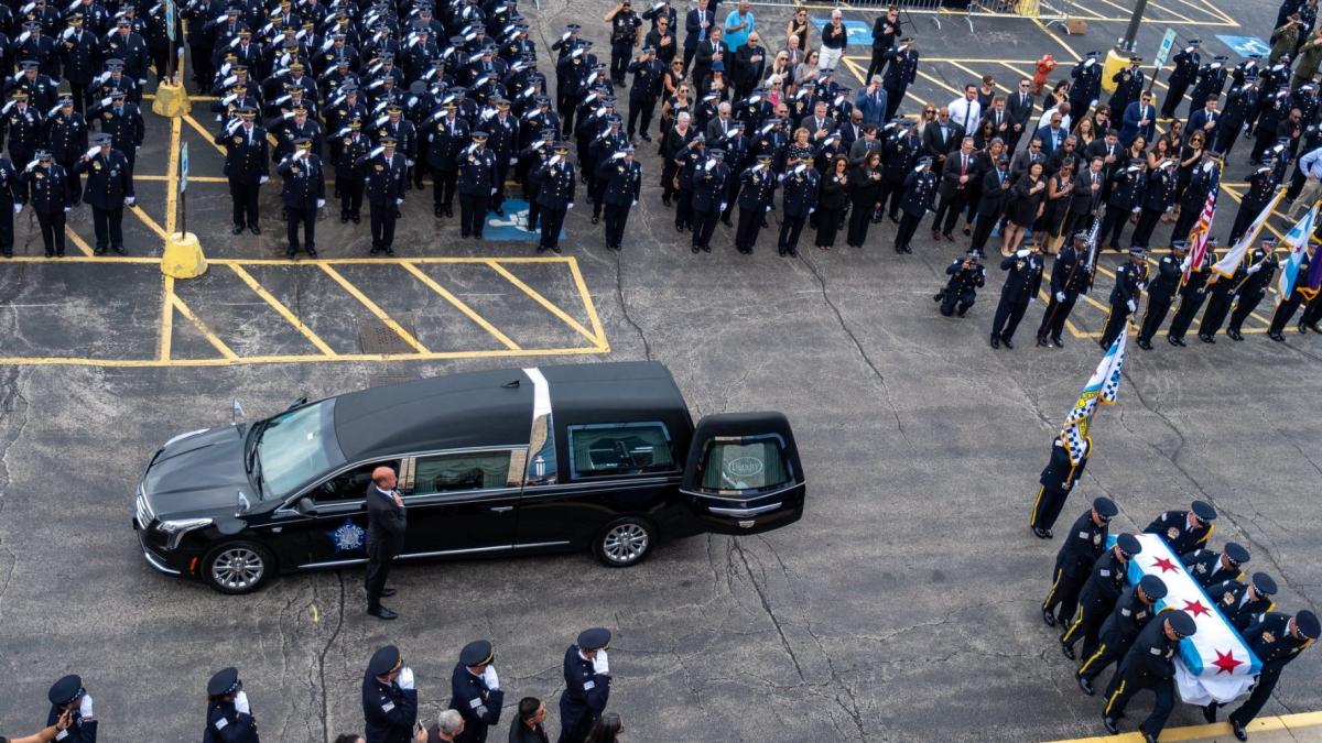 Chicago police officers salute during the funeral of Officer Krystal Rivera on June 26, 2025. (Chicago Police Department)