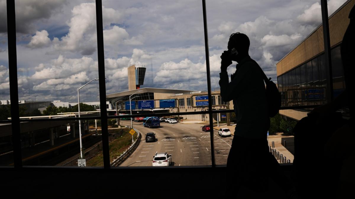 Passengers walk from a terminal at Philadelphia International Airport in Philadelphia, Tuesday, Oct. 7, 2025. (AP Photo / Matt Rourke)