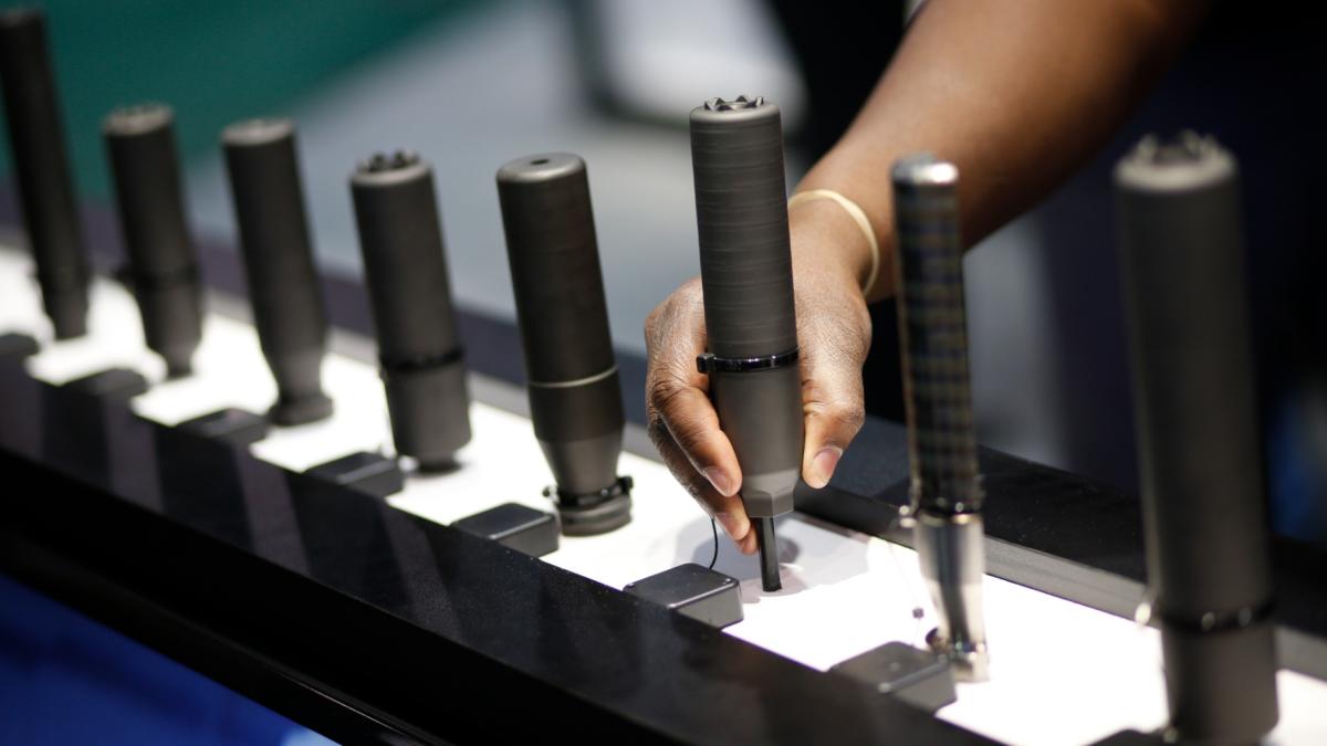 Gun silencers are on display at the Sig Sauer booth at the Shooting, Hunting and Outdoor Trade Show in Las Vegas, Jan. 19, 2016. (AP Photo / John Locher, File)