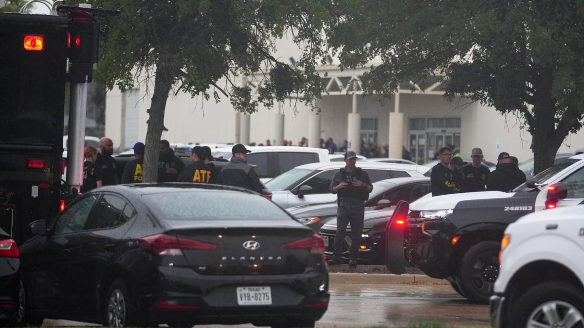 Law enforcement gather at a staging area close to a U.S. Immigration and Customs Enforcement office after a reported shooting, in Dallas on Wednesday, Sept. 24, 2025. (AP Photo / Julio Cortez)