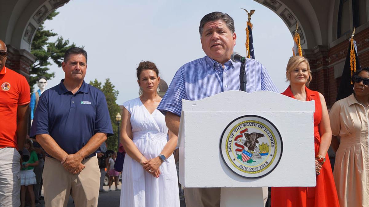 Gov. JB Pritzker speaks to reporters outside the Illinois State Fairgrounds after cutting a ribbon to officially open the fair on Thursday, Aug. 7, 2025. (Peter Hancock / Capitol News Illinois)