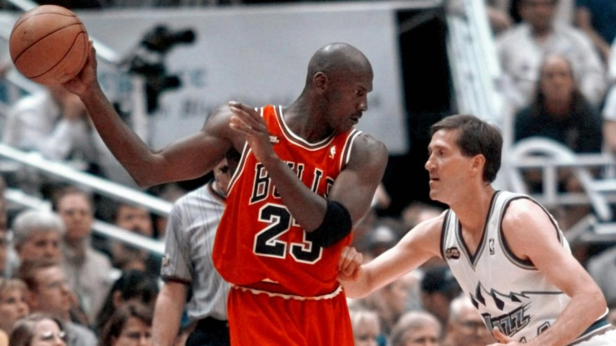 Chicago Bulls' Michael Jordan pulls the ball out of reach of Utah Jazz guard Jeff Hornacek during third quarter action in Game 2 of the NBA Finals in Salt Lake City, June 5, 1998. (AP Photo / Mark J. Terrill, file)