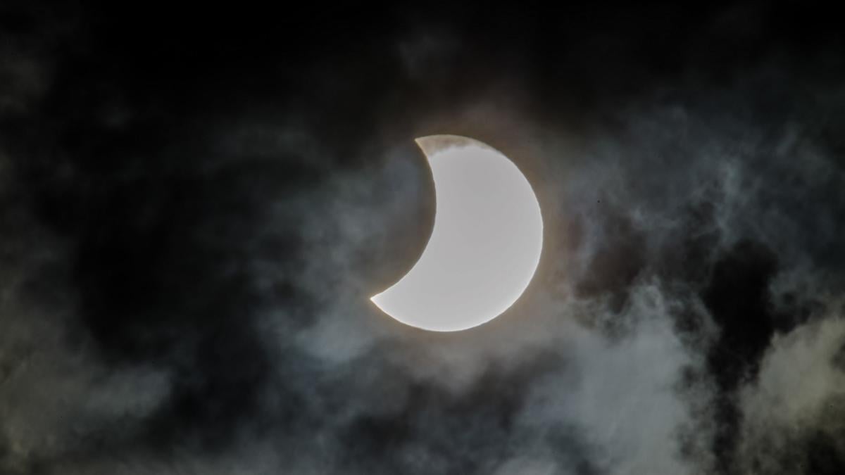 A partial lunar eclipse. As more of the moon becomes shadowed, it often appears reddish. (underworld111 / iStock)