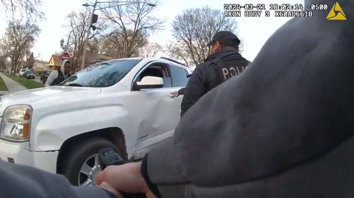 Chicago police officers surround an SUV driven by Dexter Reed moments before shots are fired on March 21, 2024. (Civilian Office of Police Accountability)