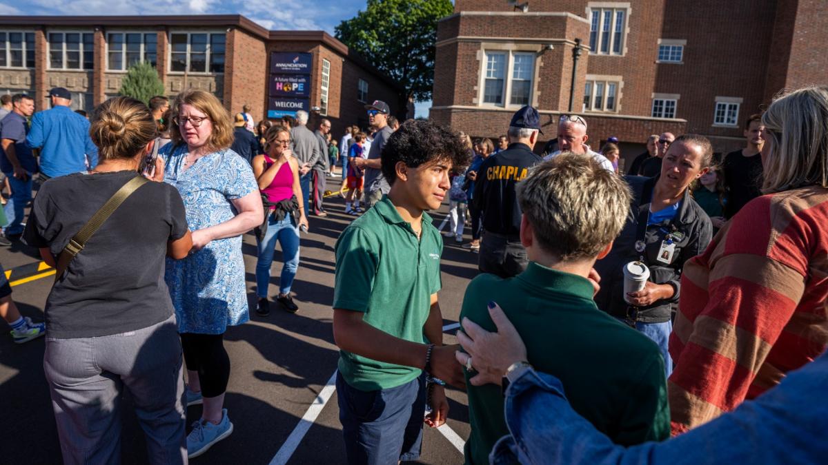 Students and parents await news during a mass shooting at the Annunciation Catholic School in Minneapolis on Wednesday, Aug. 27, 2025. (Richard Tsong-Taatarii / Star Tribune via AP)