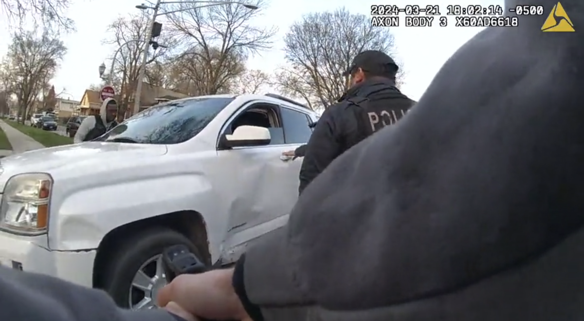 Chicago police officers surround an SUV driven by Dexter Reed moments before shots are fired on March 21, 2024. (Civilian Office of Police Accountability)