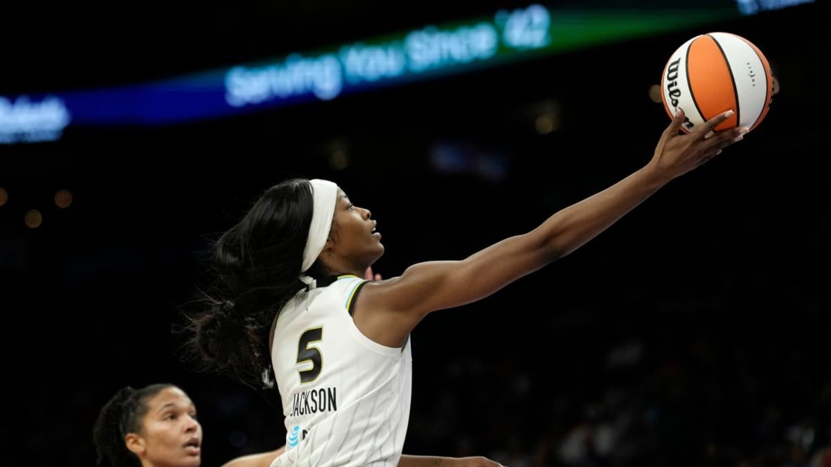 Chicago Sky forward Rickea Jackson (5) drives past Phoenix Mercury forward Alyssa Thomas to score during the second half of a WNBA basketball game, Friday, May 15, 2026, in Phoenix. (AP Photo / Ross D. Franklin)