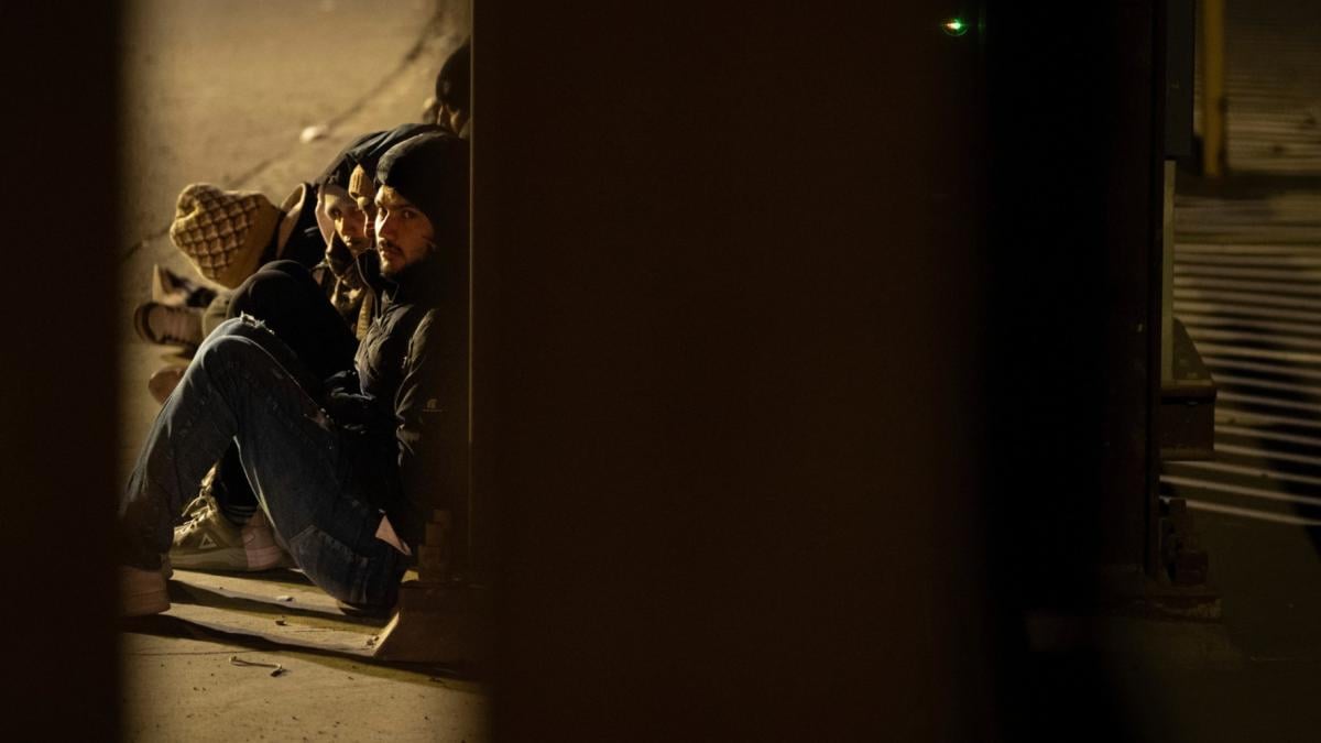 A group of migrants wait to be processed between two border walls separating Mexico and the United States after crossing illegally before dawn, Jan. 21, 2025, in San Diego. (AP Photo / Gregory Bull, File)
