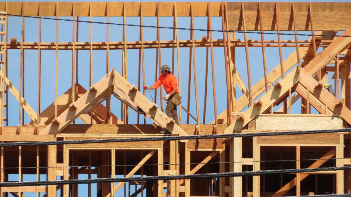 A construction worker examines part of a building under construction in Brick, N.J. on July 10, 2023. (AP Photo / Wayne Parry, File)