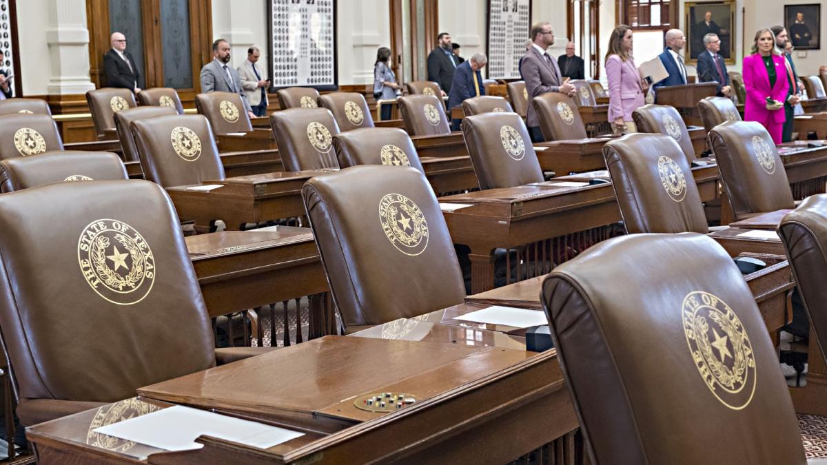 Empty chairs belonging to House Democrats remain empty during a session convocation in the State Capitol, Tuesday, Aug. 5, 2025, in Austin, Texas. (AP Photo/Rodolfo Gonzalez)