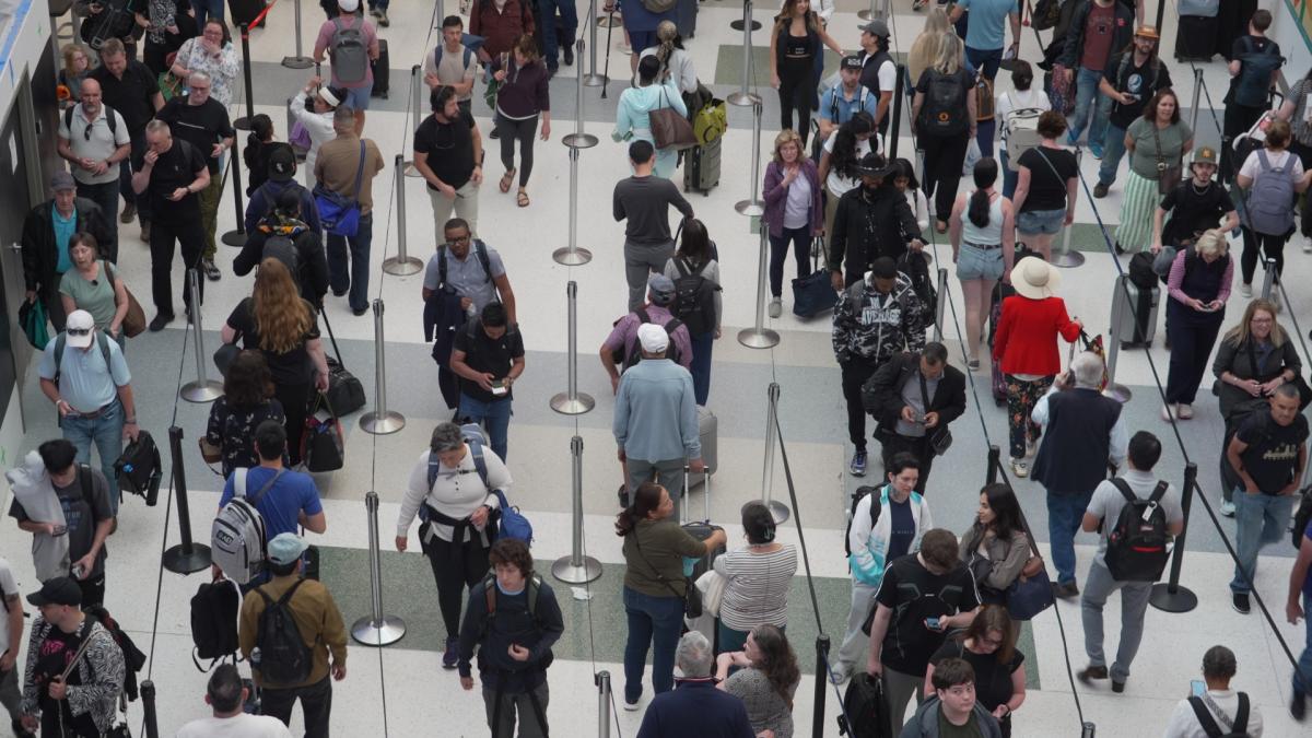 Travelers line up at a TSA checkpoint at George Bush Intercontinental Airport in Houston, Tuesday, March 24, 2026. (AP Photo / Lekan Oyekanmi)