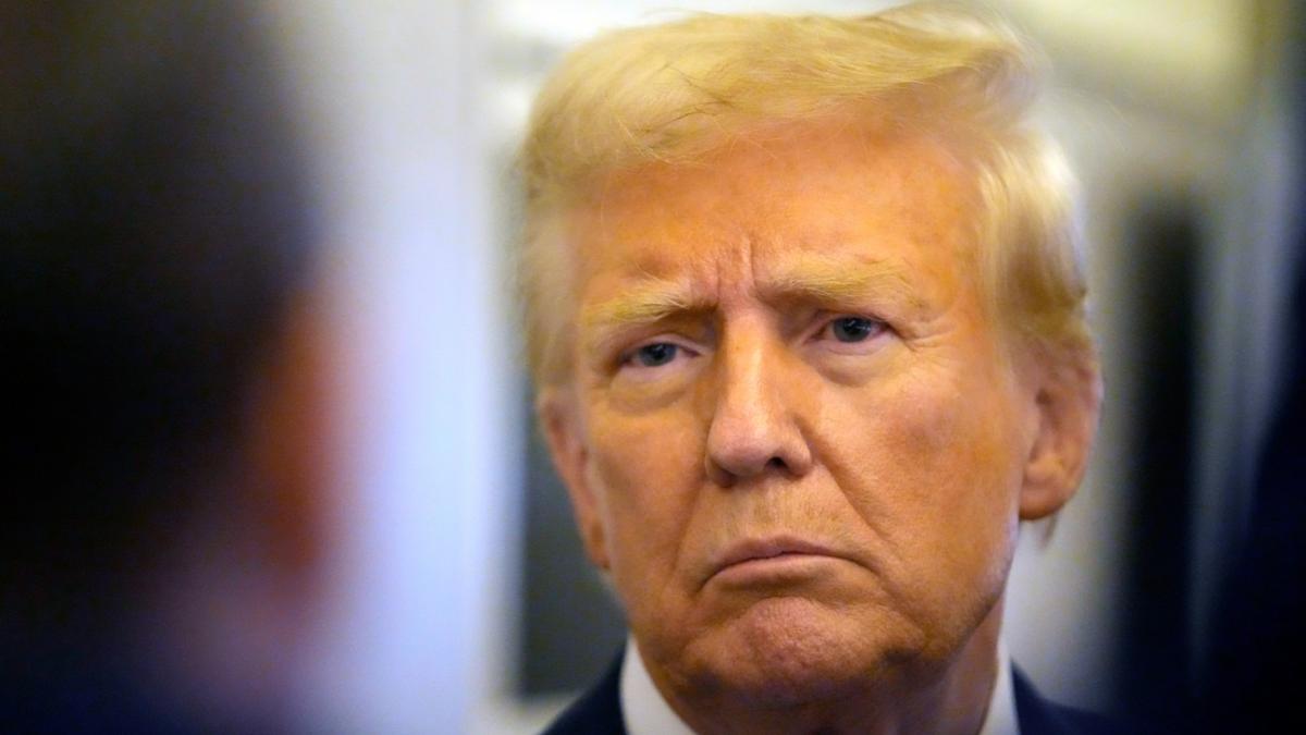 President Donald Trump speaks to reporters aboard Air Force One en route from Miami to Joint Base Andrews, Md., Monday, Jan. 27, 2025. (AP Photo / Mark Schiefelbein)