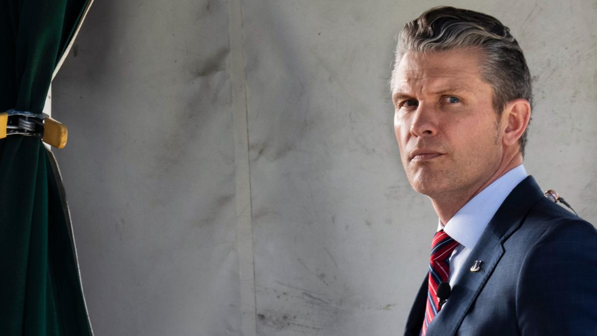 Defense Secretary Pete Hegseth does a television interview outside the White House, Friday, March 21, 2025, in Washington. (AP Photo/Jacquelyn Martin)