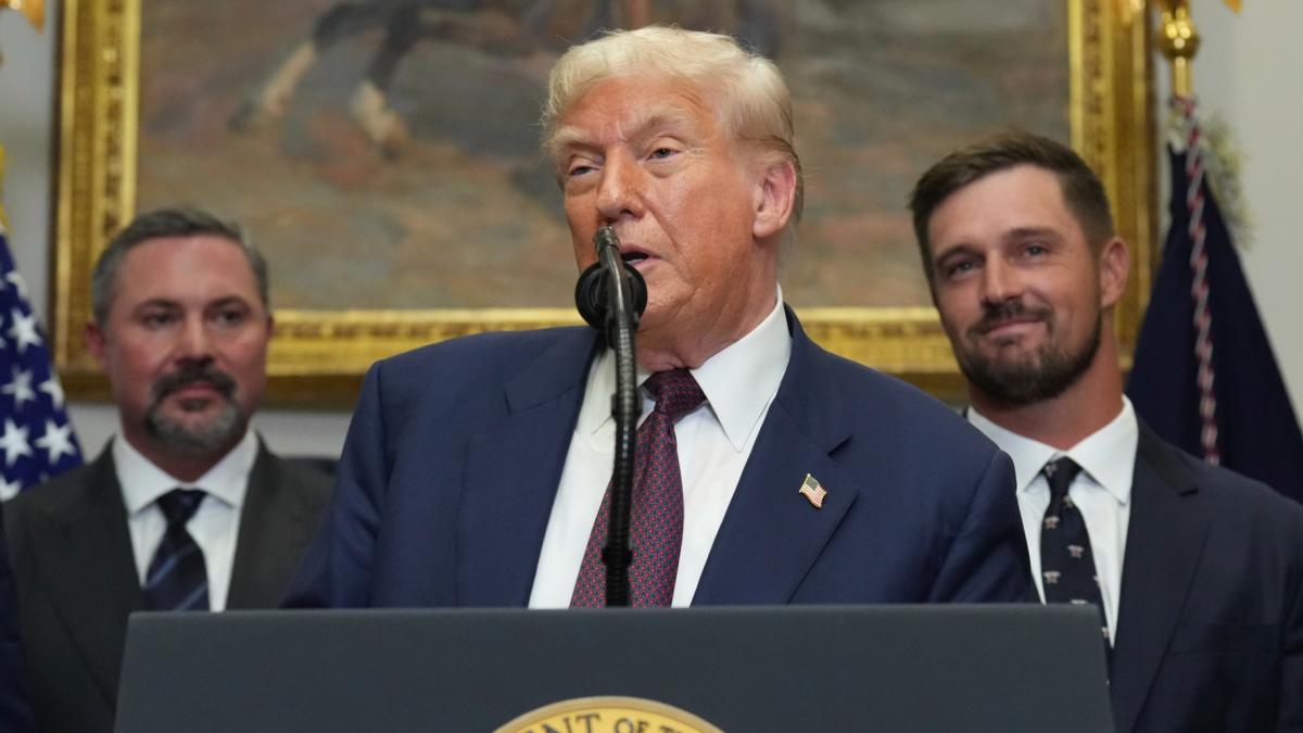 President Donald Trump speaks as Cody Campbell, left, and professional golfer Bryson DeChambeau listen during an event for the signing of an executive order restarting the Presidential Fitness Test in public schools, Thursday, July 31, 2025, in the Roosevelt Room of the White House in Washington. (AP Photo / Jacquelyn Martin)