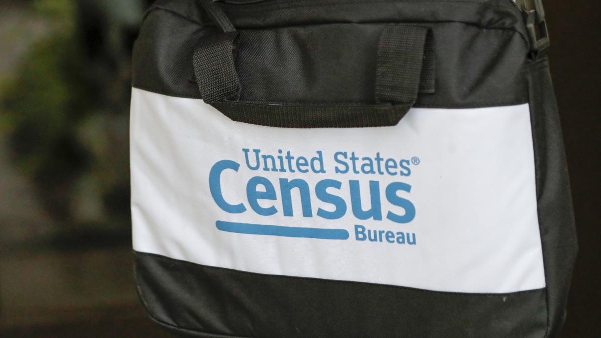 FILE - A briefcase of a census taker is seen as she knocks on the door of a residence, Aug. 11, 2020, in Winter Park, Fla. (AP Photo / John Raoux, File)