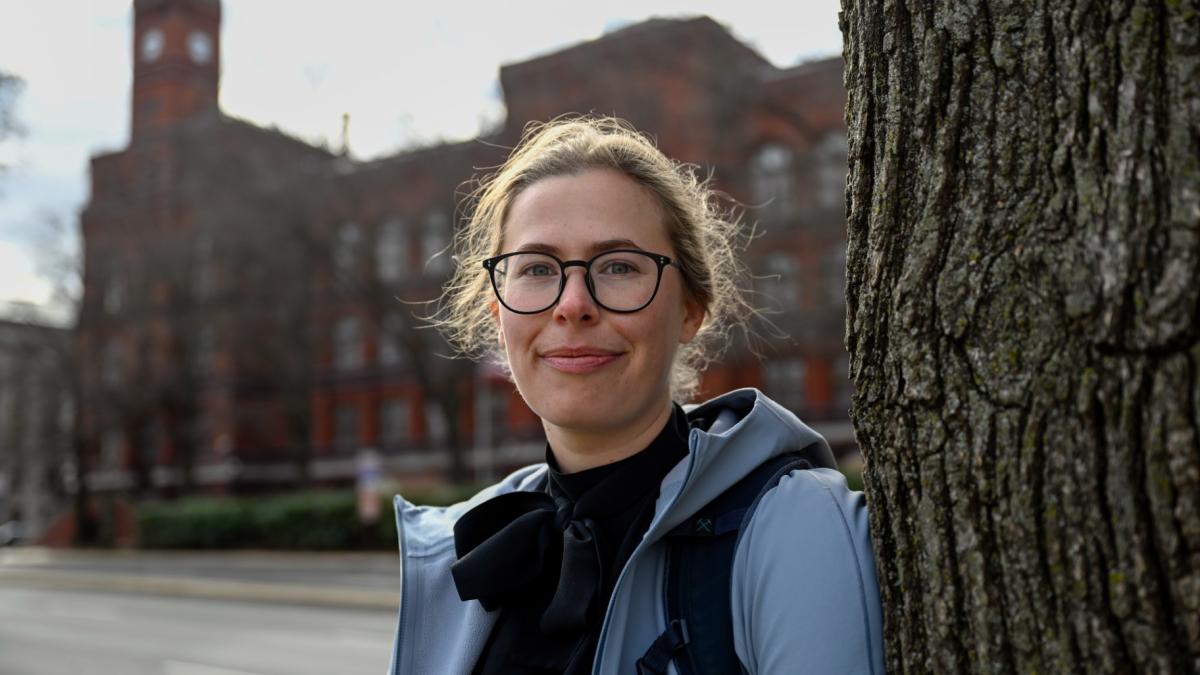 Sydney Smith, who lost her job due to DOGE cuts, stands in front of the Sydney Yates building that houses the Forest Service on Thursday, March. 6, 2025, in Washington. (AP Photo / John McDonnell)