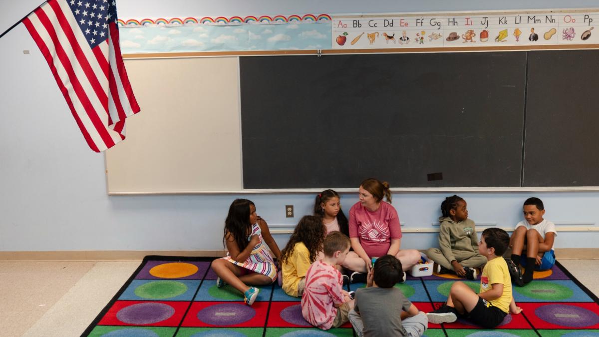 Jillian Murphy leads children in math activities during the East Providence Boys and Girls Club Summer Camp at Emma G. Whiteknact Elementary School on Thursday, July 10, 2025, in Providence R.I. (AP Photo / Sophie Park)