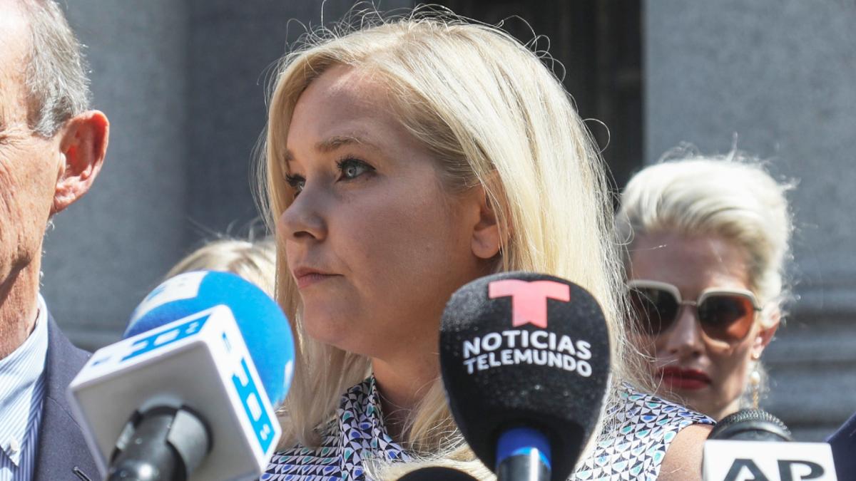 Virginia Giuffre, center, holds a news conference outside a Manhattan court in New York, Aug. 27, 2019. (AP Photo / Bebeto Matthews, File)
