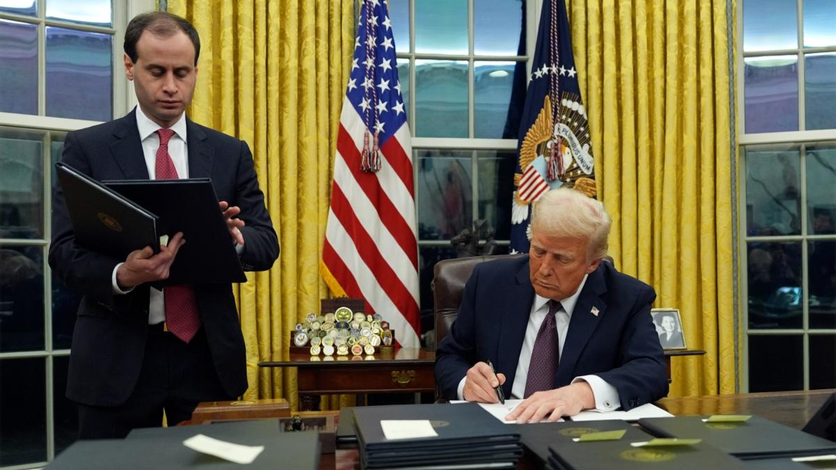 President Donald Trump signs an executive order regarding the southern border in the Oval Office of the White House, Monday, Jan. 20, 2025, in Washington. (Evan Vucci / AP Photo)