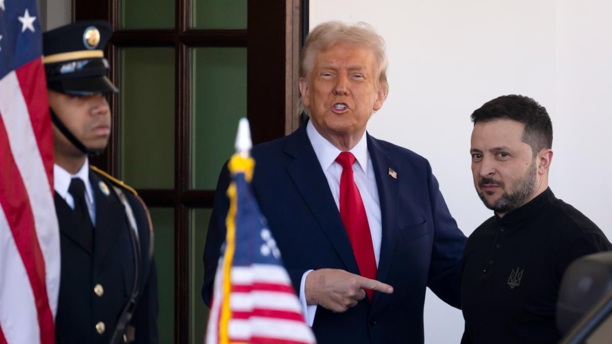 Ukraine President Volodymyr Zelenskyy, right, is greeted by President Donald Trump, center, as he arrives at the White House in Washington, Friday, Feb. 28, 2025. (Ben Curtis / AP Photo)