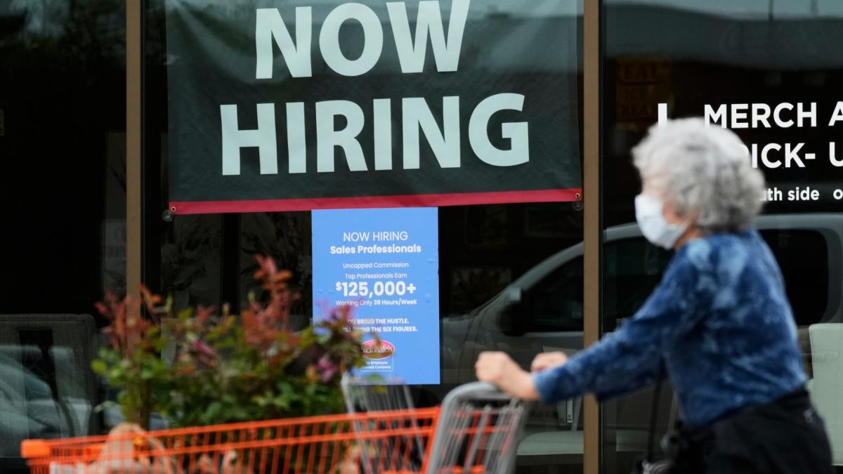 Hiring sign for sales professionals is displayed at a store, in Vernon Hills, Ill., Wednesday, April 15, 2026. (AP Photo / Nam Y. Huh, file)