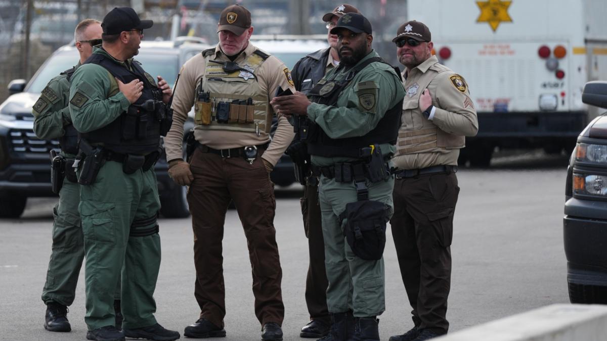 Law enforcement officers guard outside an ICE processing facility in the Chicago suburb of Broadview, Ill., on Nov. 21, 2025. (AP Photo / Nam Y. Huh, File)