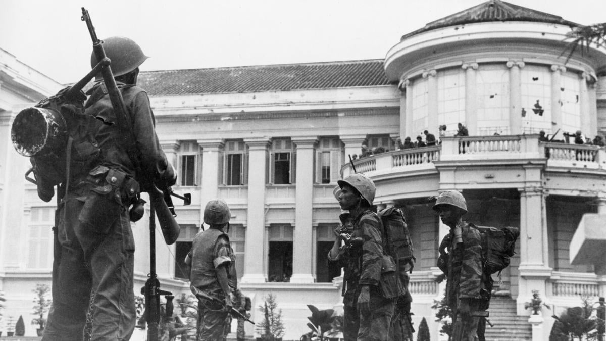 FILE - South Vietnamese rebel troops take up positions in the yard of the presidential palace, residence of President Ngo Dinh Diem, in Saigon, Vietnam, Nov. 1, 1963. Diem and his brother Nhu escaped the coup but were captured in the aftermath of the overthrow. (AP Photo / Horst Faas, File)