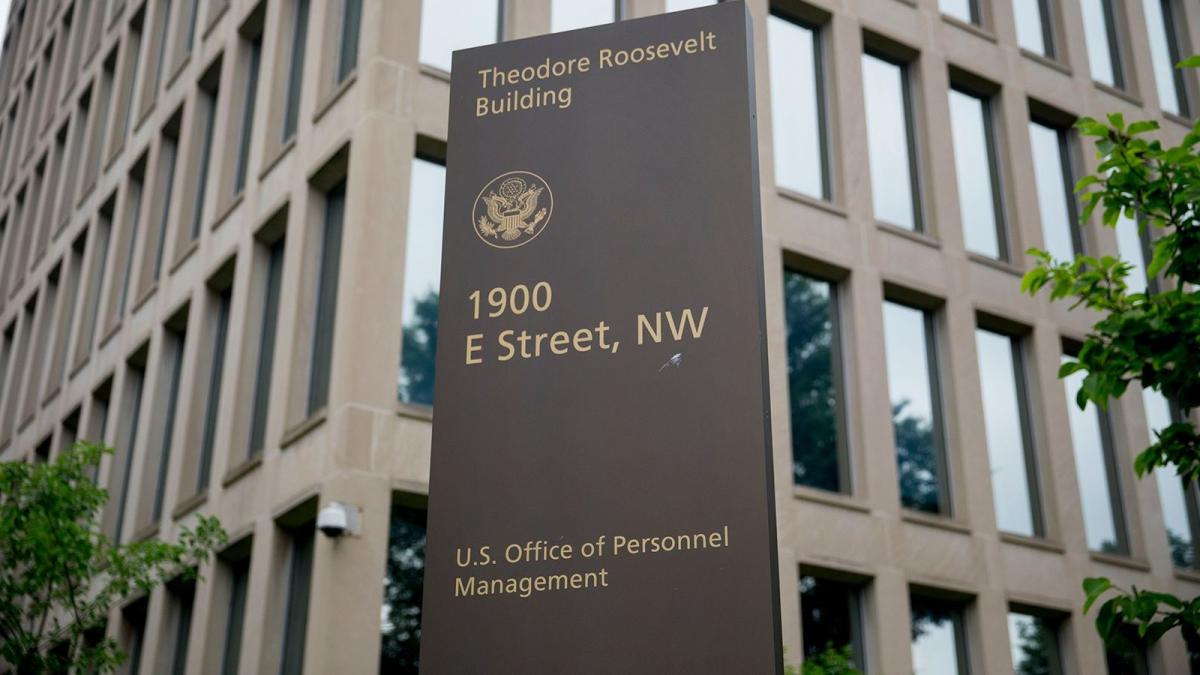 A sign stands outside of the Theodore Roosevelt Building, headquarters of the U.S. Office of Personnel Management (OPM), in Washington, DC, US, on Friday, June 5, 2015. (Andrew Harrer / Bloomberg / Getty Images via CNN Newsource)