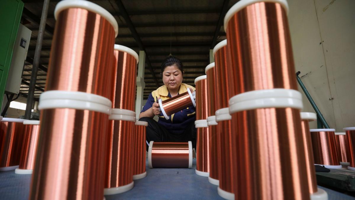 A worker processes copper wire at a workshop in Huaian City, East China’s Jiangsu Province, on June 28, 2023. (CFOTO / Future Publishing / Getty Images via CNN Newsource)