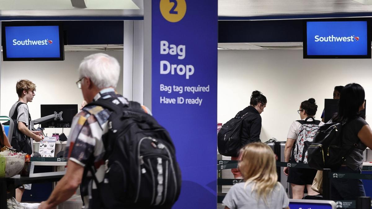 Southwest Airlines customers will soon have to pay to check a bag. (Mario Tama / Getty Images via CNN Newsource)