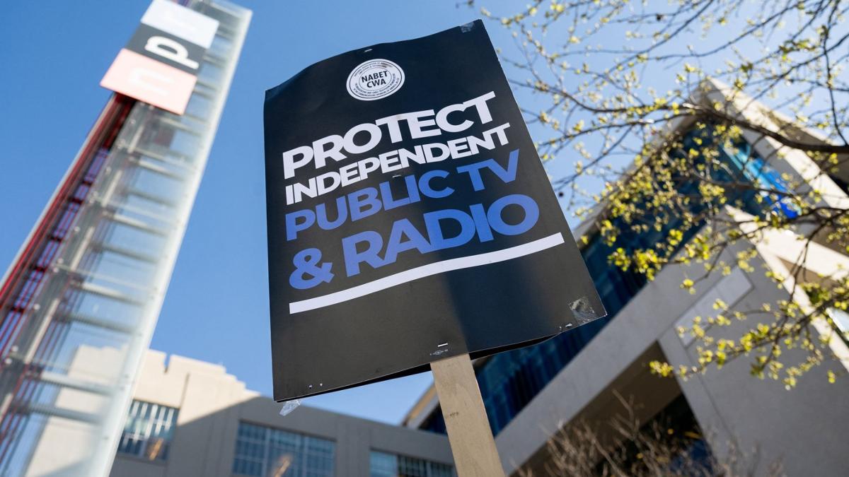 People participate in a rally to call on Congress to protect funding for US public broadcasters, Public Broadcasting Service and National Public Radio, outside the NPR headquarters in Washington, DC, on March 26. (Saul Loeb / AFP / Getty Images via CNN Newsource)