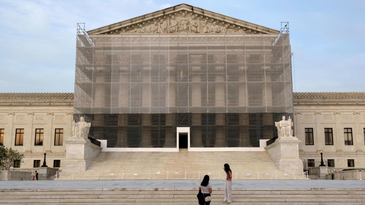 People take photos at the U.S. Supreme Court at dusk on June 10, 2025, in Washington, DC. (Kevin Carter/Getty Images via CNN Newsource)