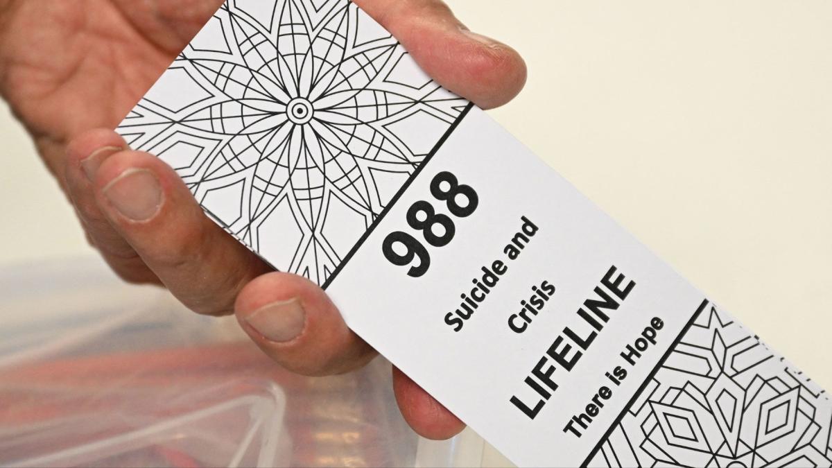In October 2020, President Donald Trump signed a bipartisan bill making 988 the universal telephone number to reach the national suicide prevention hotline. (Patrick T. Fallon / AFP / Getty Images via CNN Newsource)