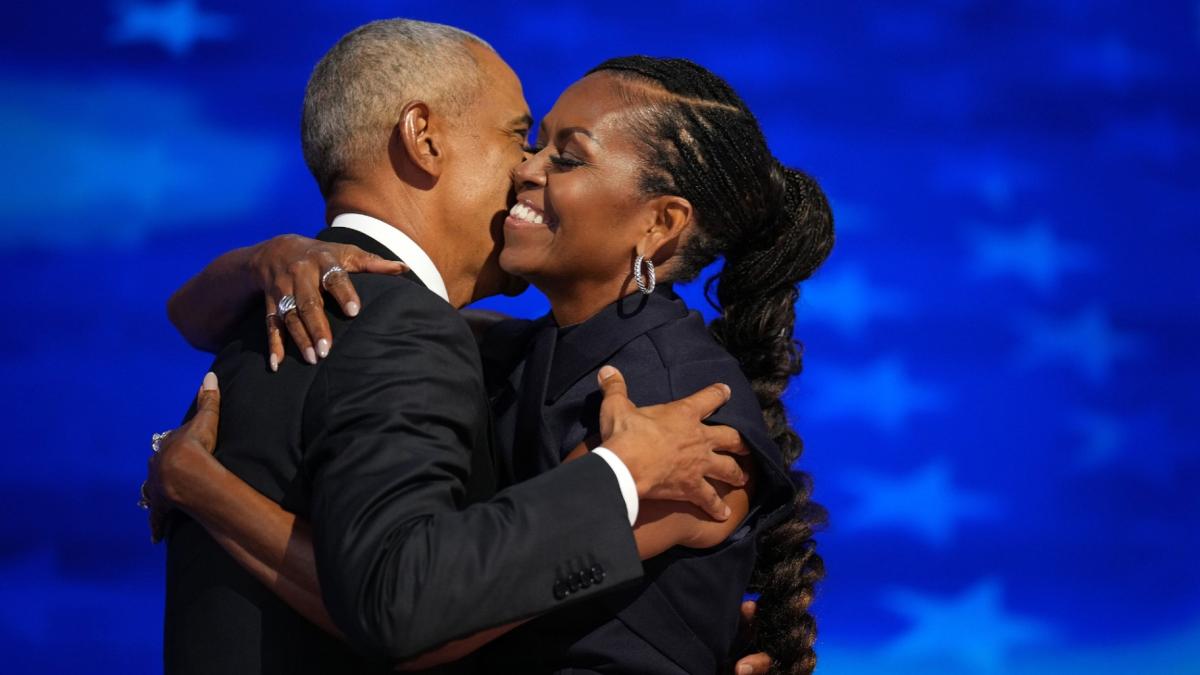 Former U.S. President Barack Obama greets former first lady Michelle Obama as he arrives to speak on stage during the second day of the Democratic National Convention at the United Center on Aug. 20, 2024 in Chicago. (Andrew Harnik / Getty Images via CNN Newsource)