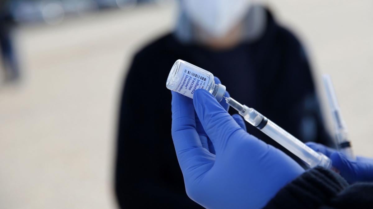 A health care worker prepares flu shots during a drive-thru clinic at the Louisiana State Fairgrounds in Shreveport, Louisiana, in November 2020. (Dylan Hollingsworth / Bloomberg / Getty Images via CNN Newsource)