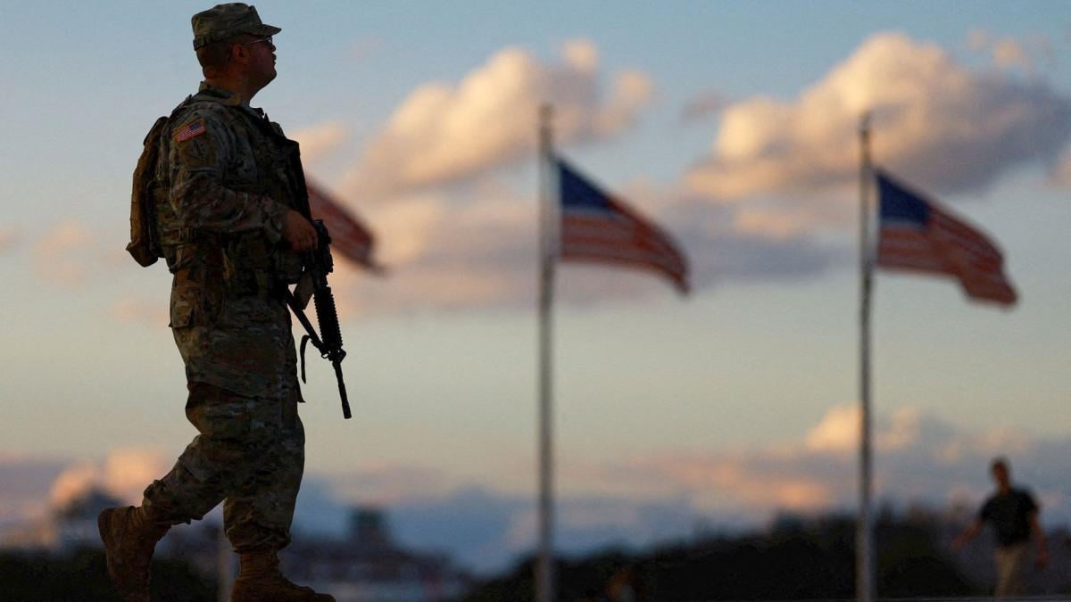 A member of the National Guard carries a firearm while patrolling the National Mall, weeks after President Donald Trump ordered the National Guard and law enforcement to patrol the nation's capital to assist in crime prevention, in Washington, D.C., Aug. 26, 2025. (Jose Luis Gonzalez / Reuters via CNN Newsource)