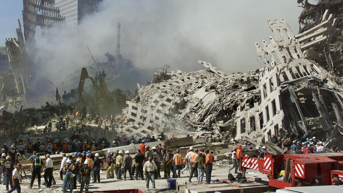 Smoke rises from the rubble of the World Trade Center in September 2001, as crews search for survivors and victims from the terror attacks two days earlier. (Beth A. Keiser / AFP / Getty Images via CNN Newsource)