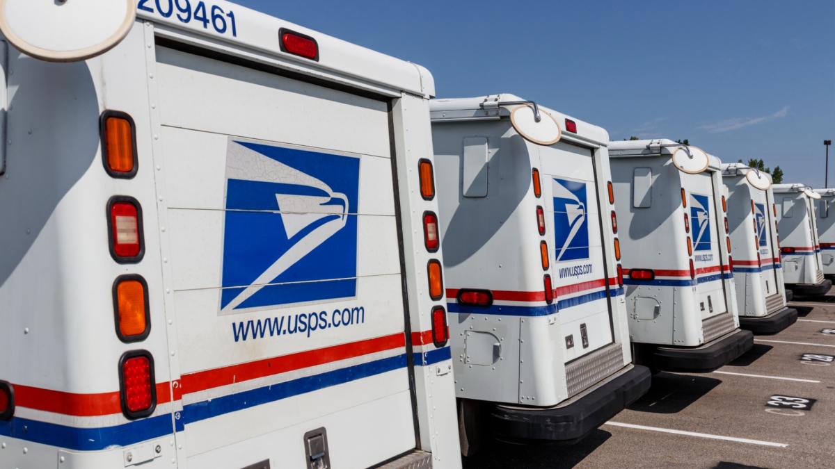 U.S. Postal Service vehicles are pictured in a file photo. (jetcityimage / iStock)
