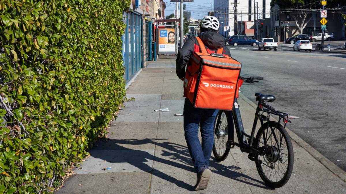 A DoorDash delivery worker is pictured in a file photo. (hapabapa / iStock)