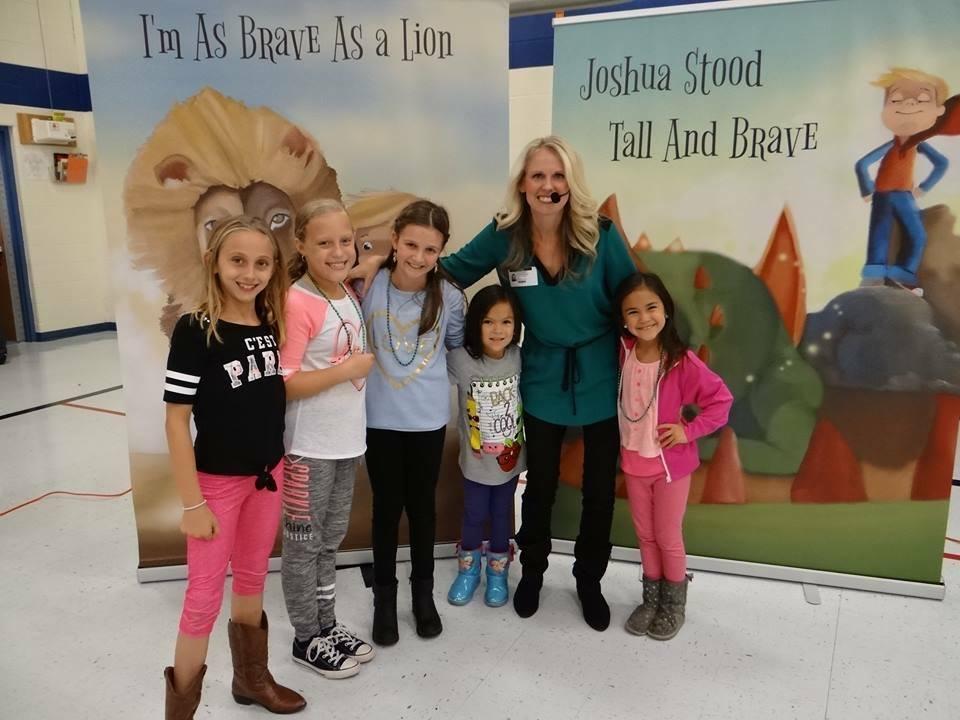 Stacey Glorioso with students at Freedom Elementary during a pep rally for “Joshua’s Dragon.”