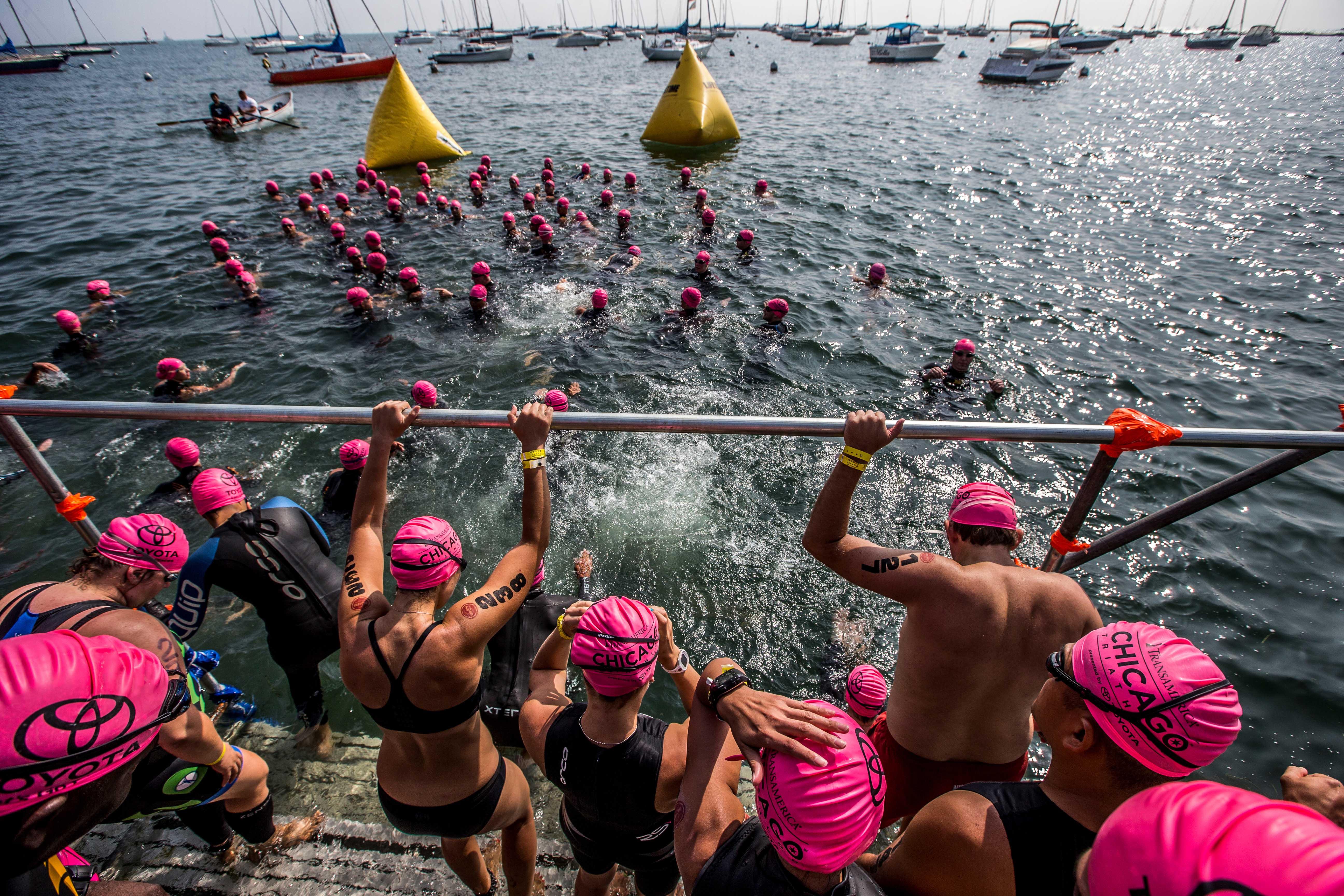 A wave of swimmers start their race in Lake Michigan at the 2015 Chicago Triathlon. (Courtesy of Transamerica Chicago Triathlon)
