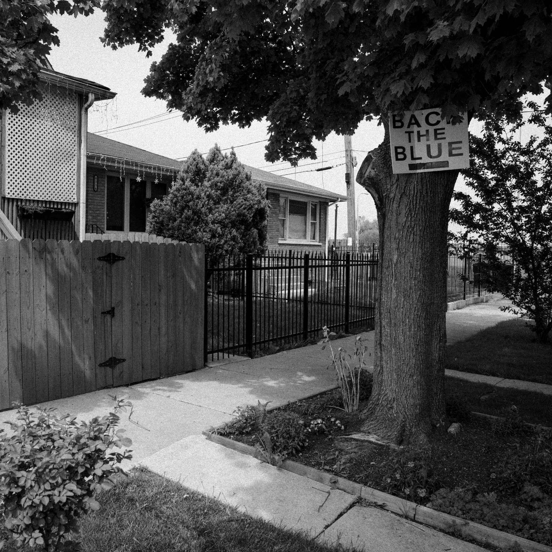 A “back the blue” sign hangs near the location where French was killed in 2021. (Sarahbeth Maney / ProPublica)