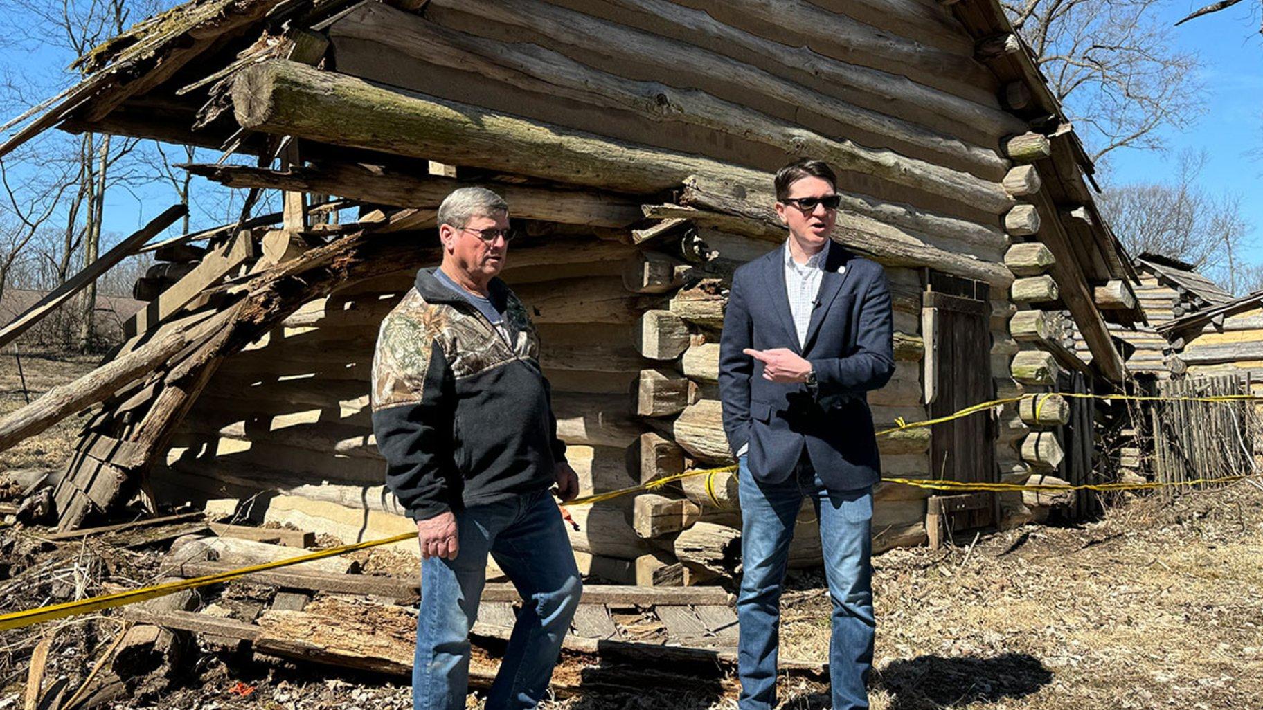 State Rep. Wayne Rosenthal, R-Morrisonville, and state Sen. Steve McClure, R-Springfield, show reporters around to deteriorating structures at Lincoln’s New Salem Historic Site in Petersburg on March 10, 2025. (Athan Yanos / Medill Illinois News Bureau)