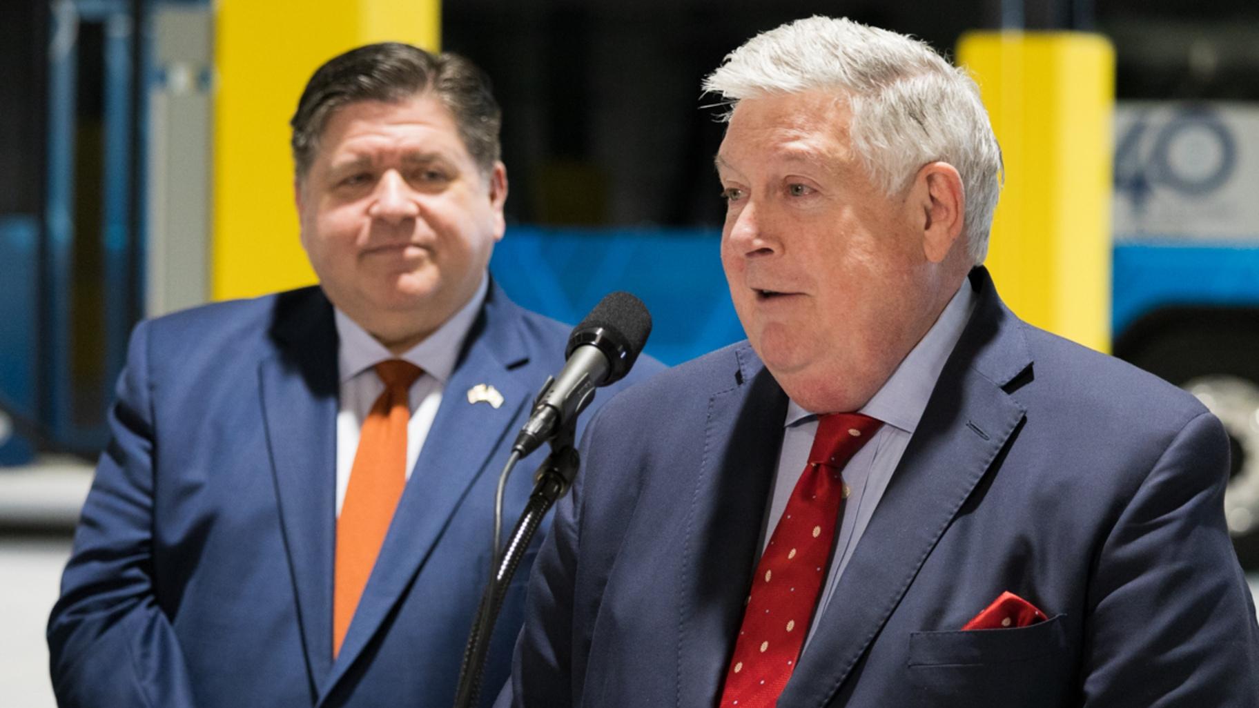 Regional Transportation Authority Board Chair Kirk Dillard speaks at an event promoting new electric Pace buses in early February 2025 while Gov. J.B. Pritzker watches. (Andrew Adams / Capitol News Illinois)