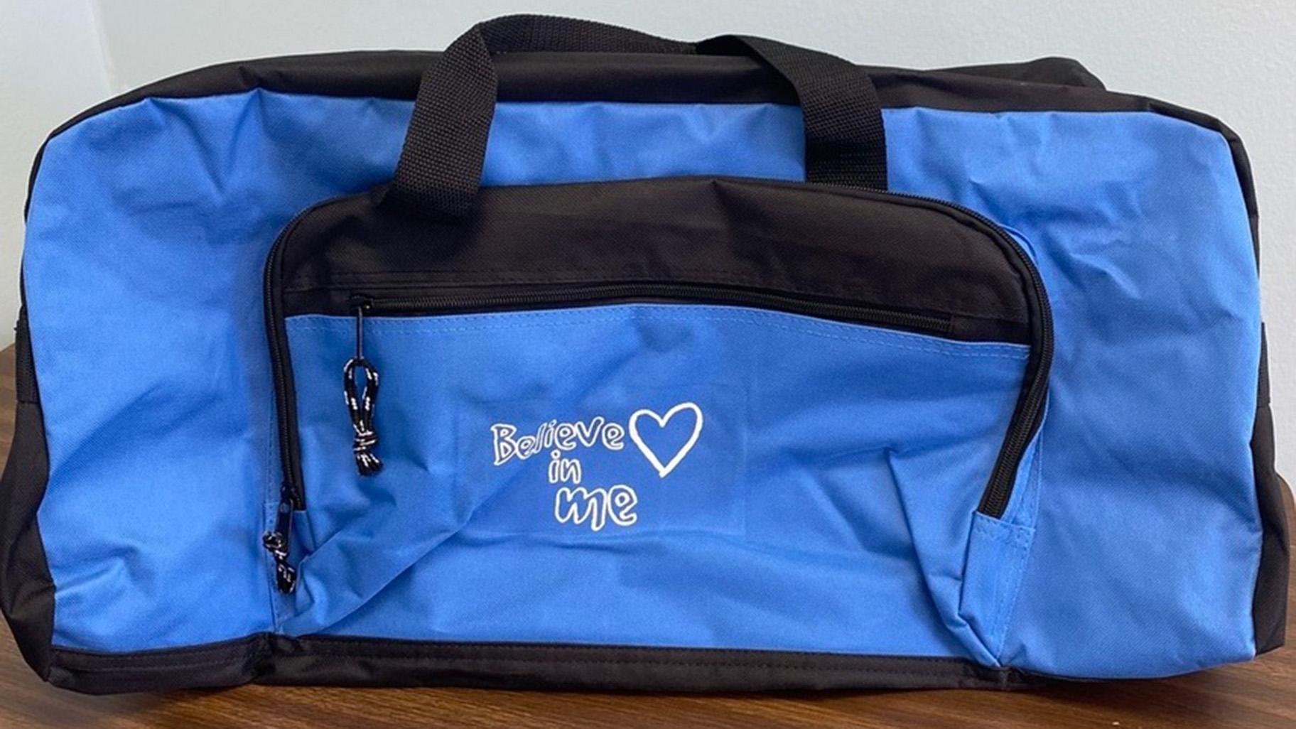 Per a 2021 law, the Department of Children and Family Services is required to “ensure” foster children have “appropriate baggage” during a move from one placement to another — instead of moving their belongings in trash bags or pillowcases. Though the agency is not in perfect compliance, DCFS now gives out duffel bags like this one in addition to donated luggage and backpacks collected by nonprofits. (Photo provided by DCFS)